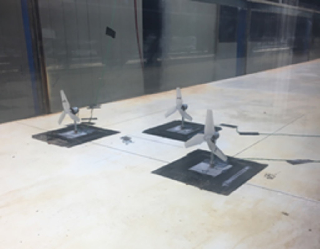 Three hydrokinetic turbines sitting on a lab table